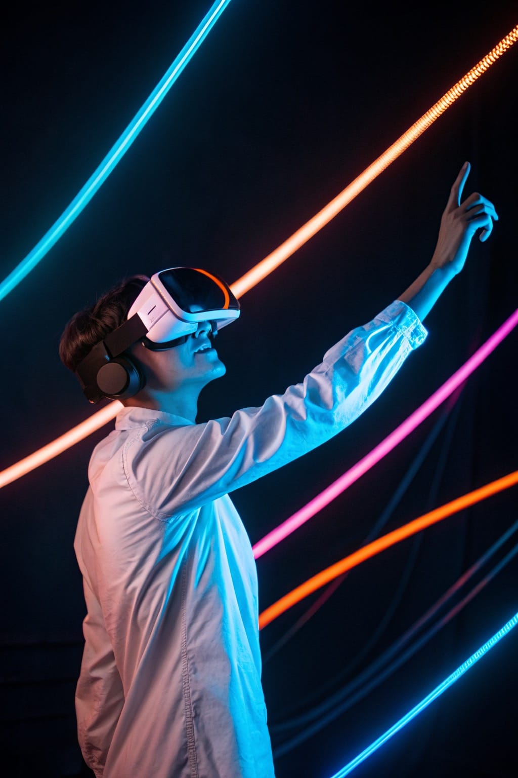 Person wearing VR headset with neon light streaks in dark studio