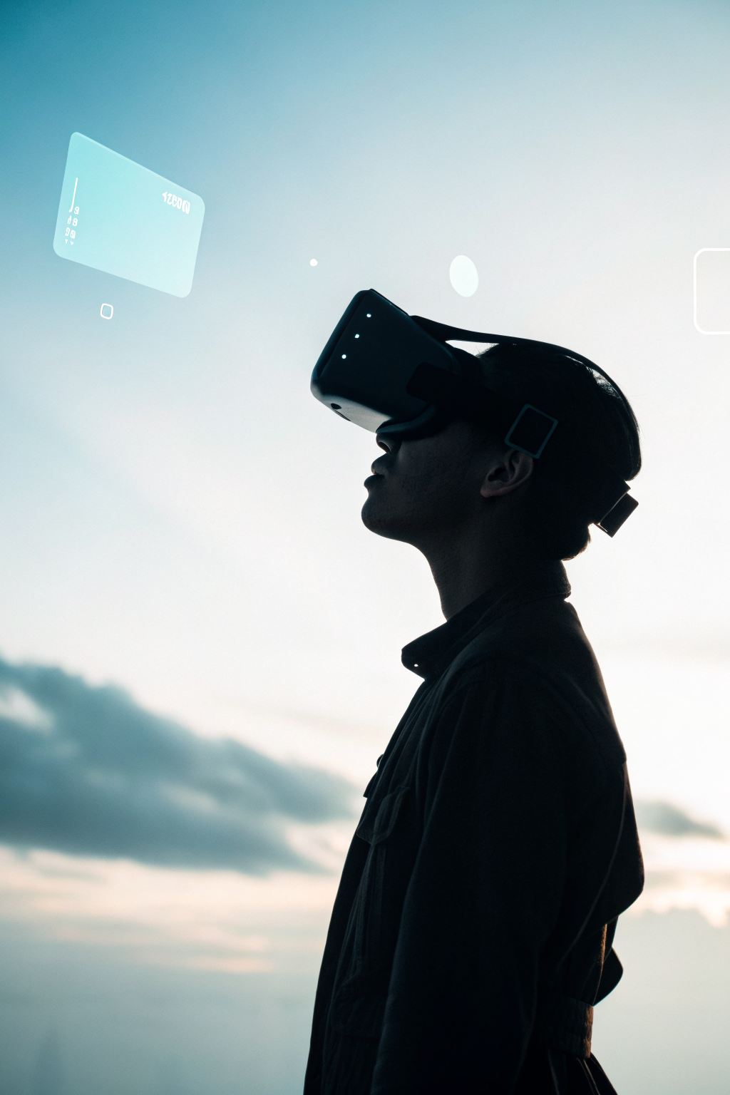 Silhouette of person wearing VR headset against pale blue gradient background