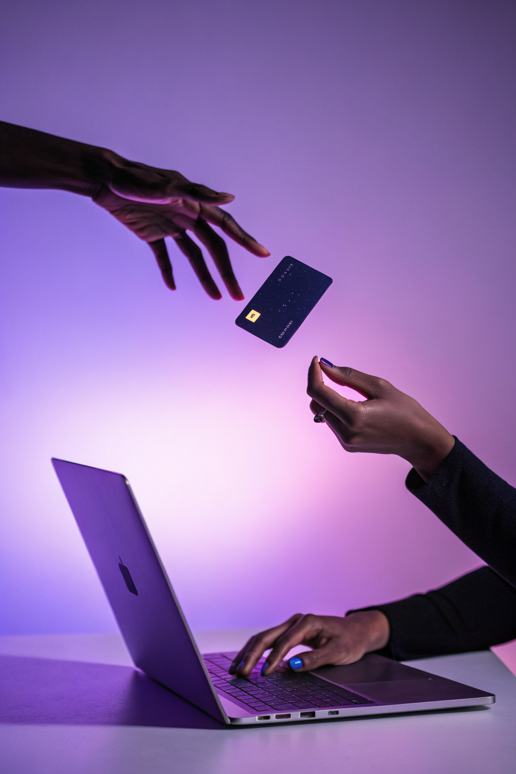 Abstract card with text-like patterns floating between hands against purple background suggesting data analysis